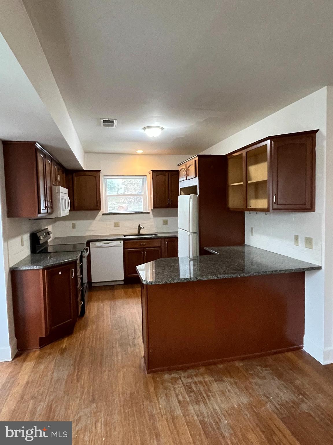 5 Ehst Road Bechtelsville, PA 19505 - Photo 6 of 23 a large kitchen with wooden floors and stainless steel appliances