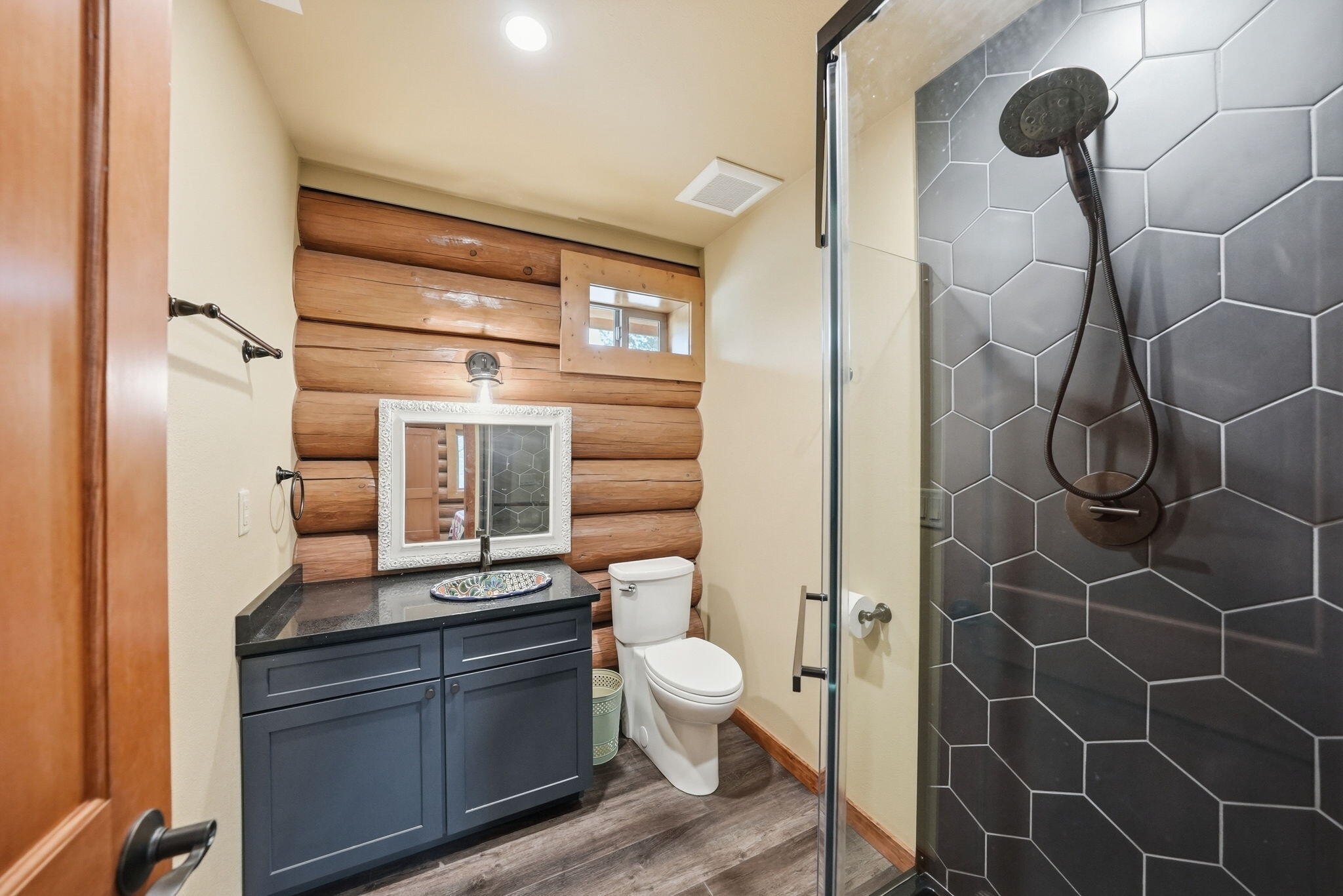 54270 Huntington Road La Pine, OR 97739 - Photo 23 of 68 a bathroom with a granite countertop sink a toilet and shower