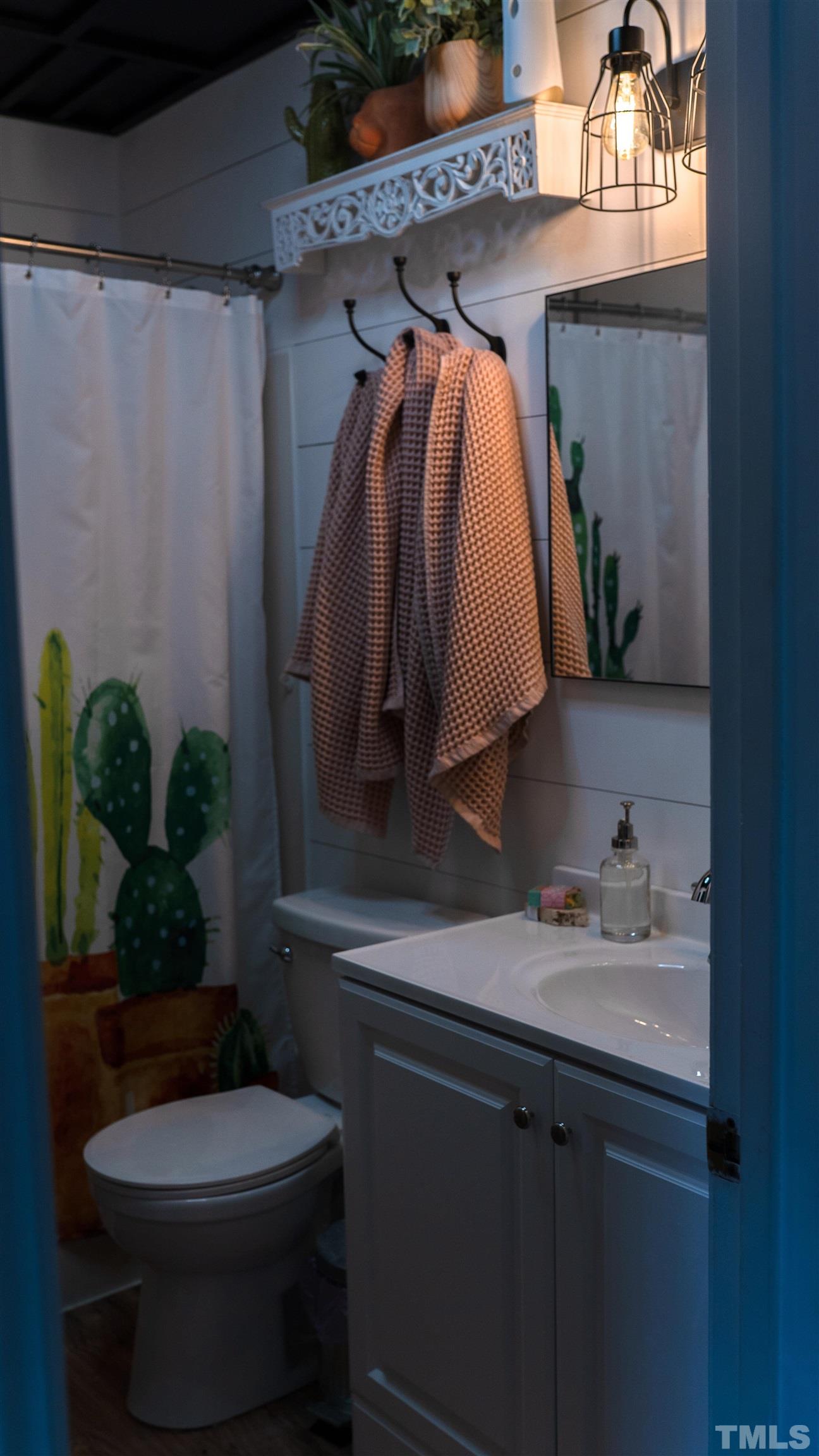 7921 Mandrel Way Raleigh, NC 27616 - Photo 21 of 32 a bathroom with a toilet and a sink