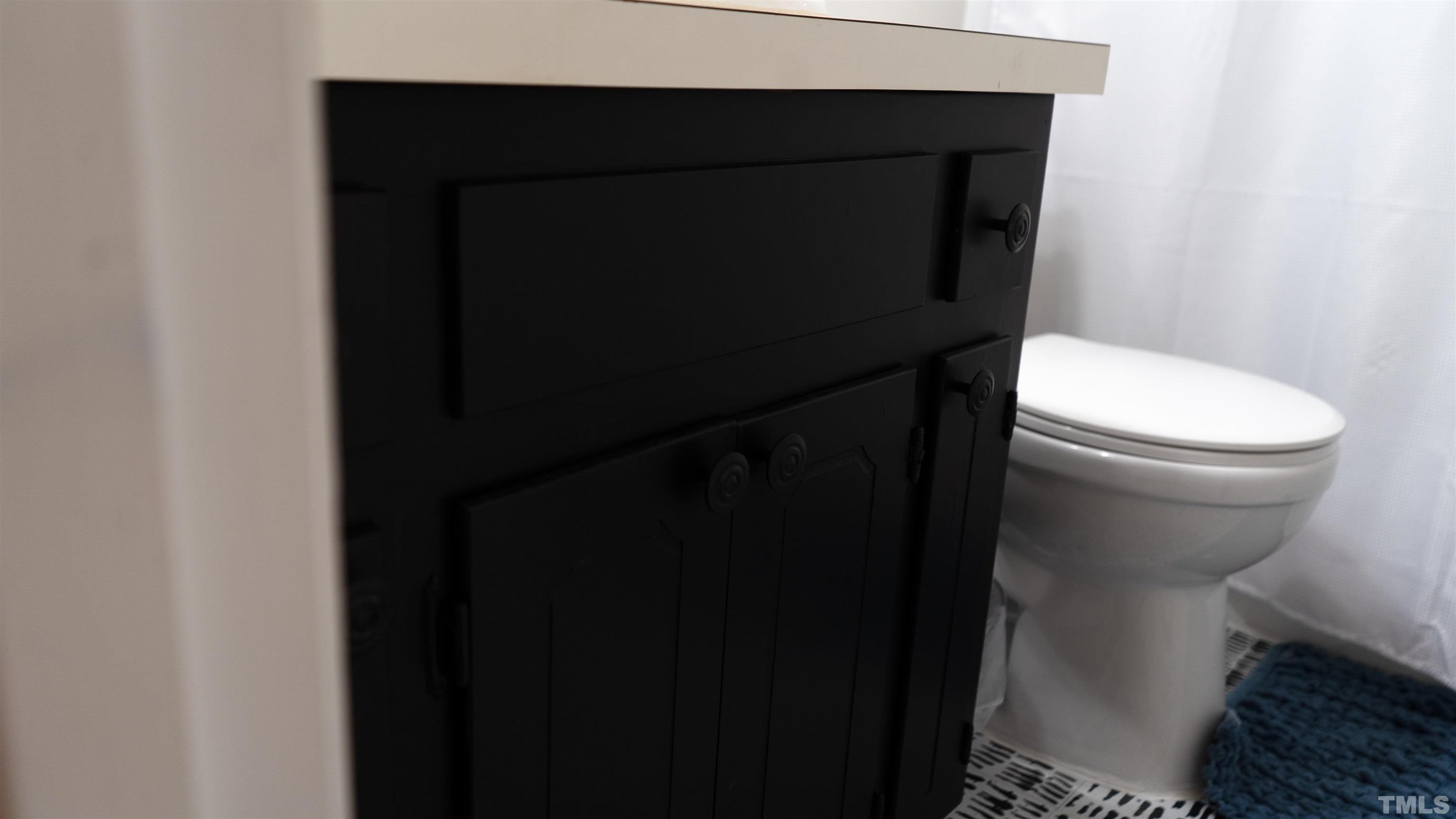 7921 Mandrel Way Raleigh, NC 27616 - Photo 24 of 32 a bathroom with a toilet and a sink
