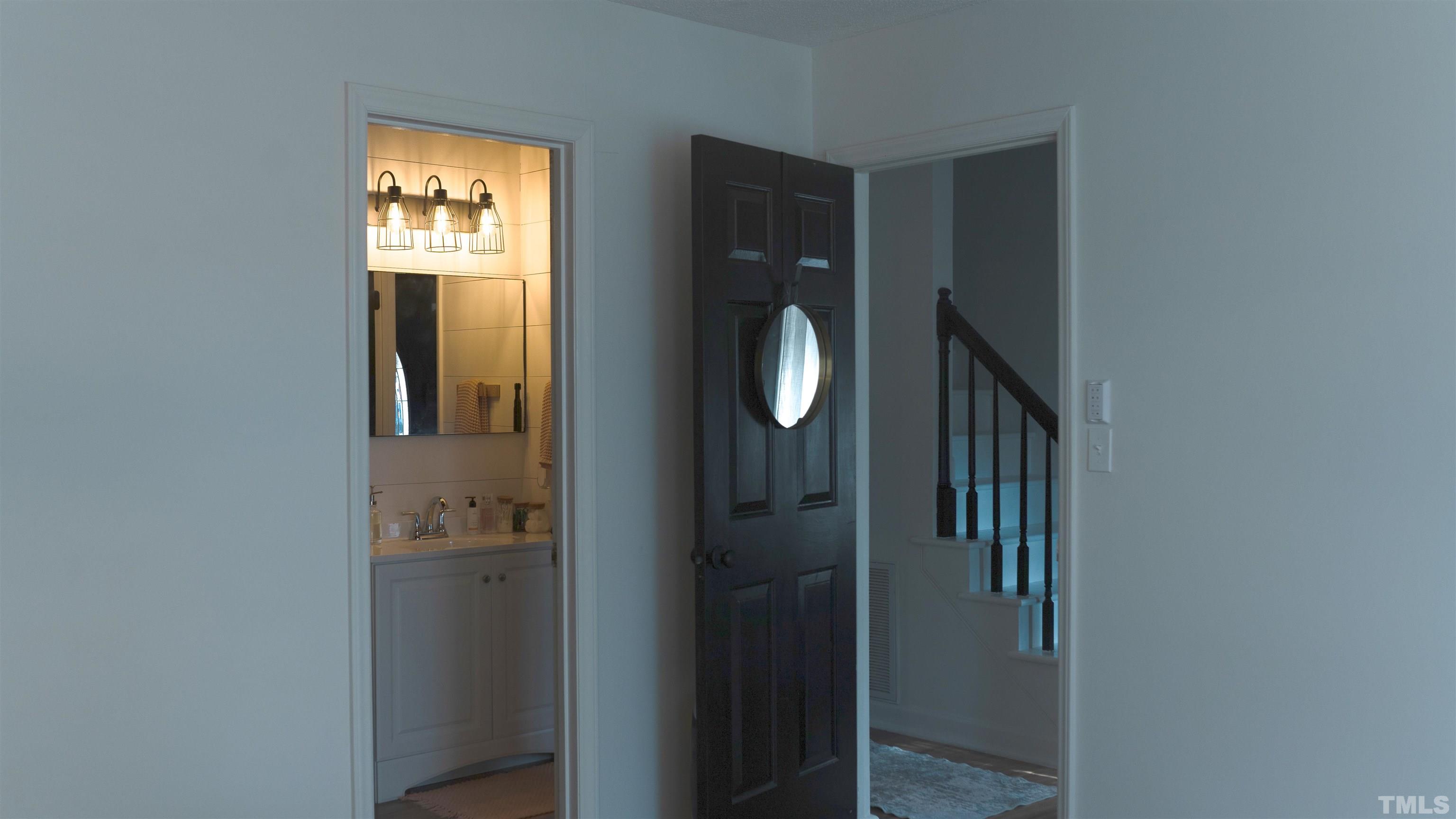 7921 Mandrel Way Raleigh, NC 27616 - Photo 30 of 32 a view of a livingroom from a hallway