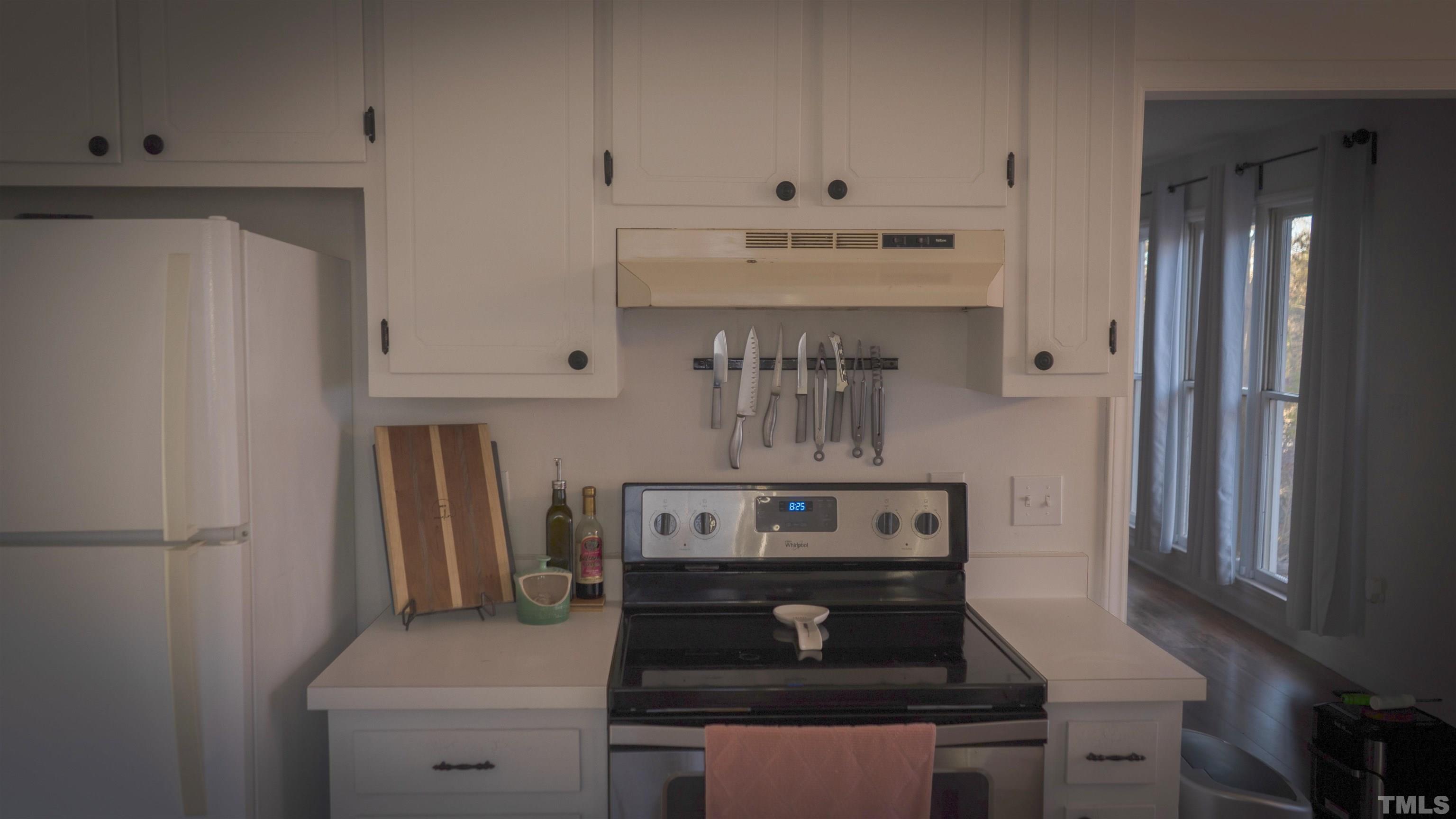 7921 Mandrel Way Raleigh, NC 27616 - Photo 10 of 32 a stove top oven sitting inside of a kitchen
