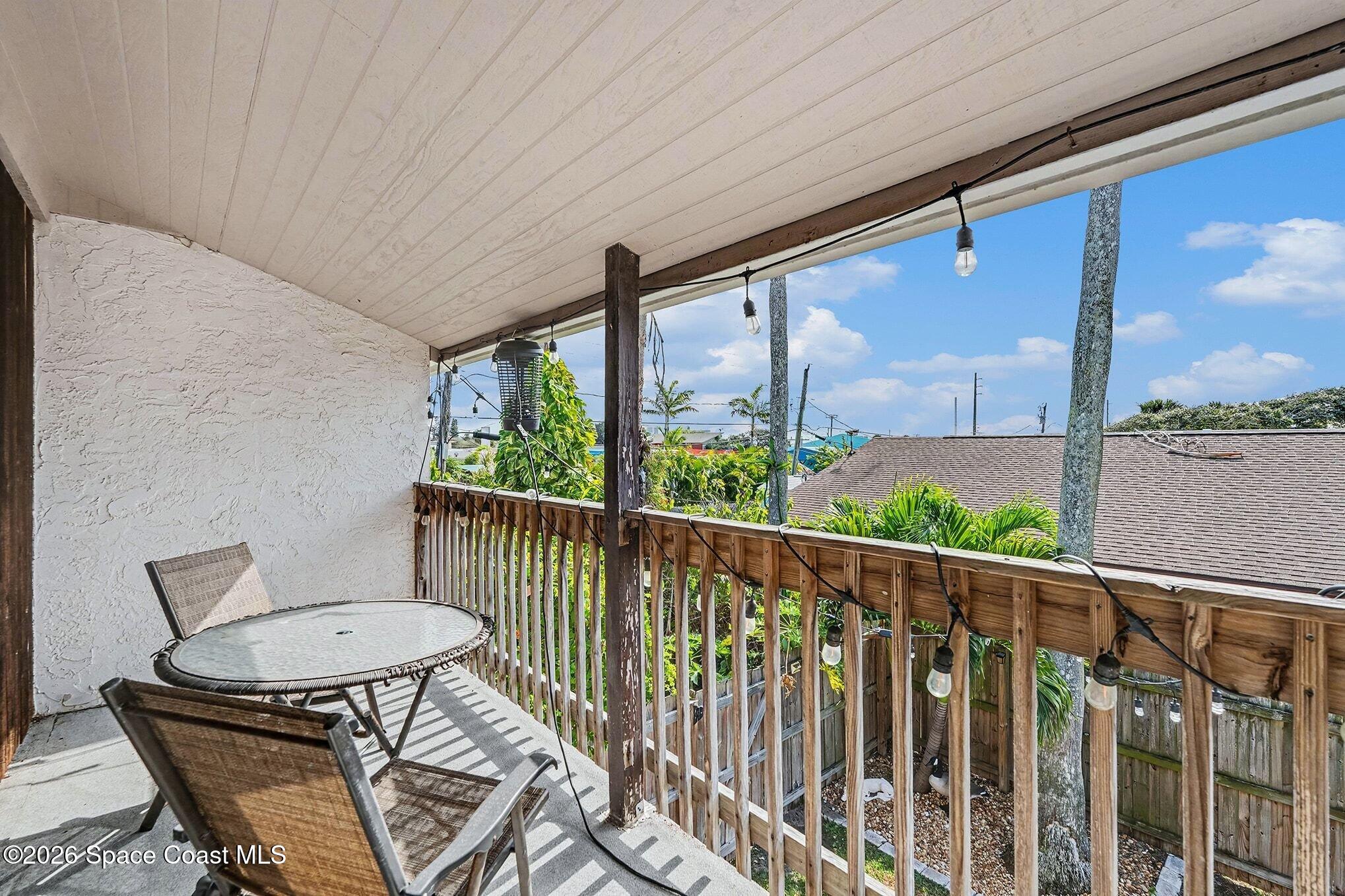 290 North 2nd Street, Unit 3 Cocoa Beach, FL 32931 - Photo 23 of 31 a view of a chair and table in the balcony