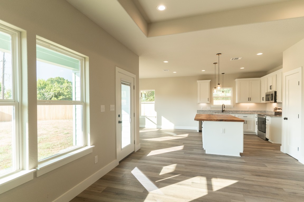 329 String Prairie Way Smithville, TX 78957 - Photo 7 of 33 Looking into Kitchen from Family Room