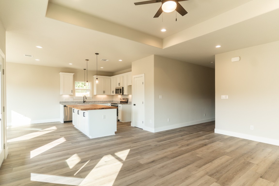 329 String Prairie Way Smithville, TX 78957 - Photo 8 of 33 Looking into Kitchen from Family Room