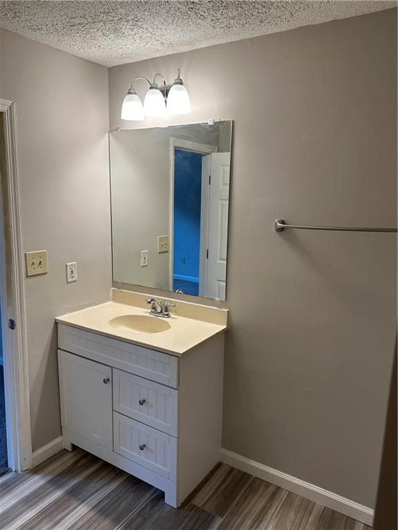 1923 Cheatham Woods Drive Southwest Marietta, GA 30008 - Photo 16 of 20 a bathroom with a sink and a mirror