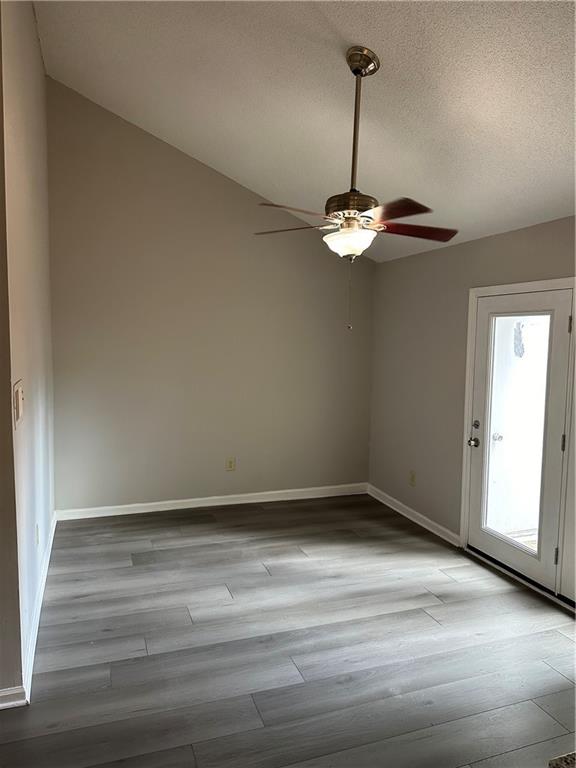 1923 Cheatham Woods Drive Southwest Marietta, GA 30008 - Photo 4 of 20 a view of a room with wooden floor and white walls