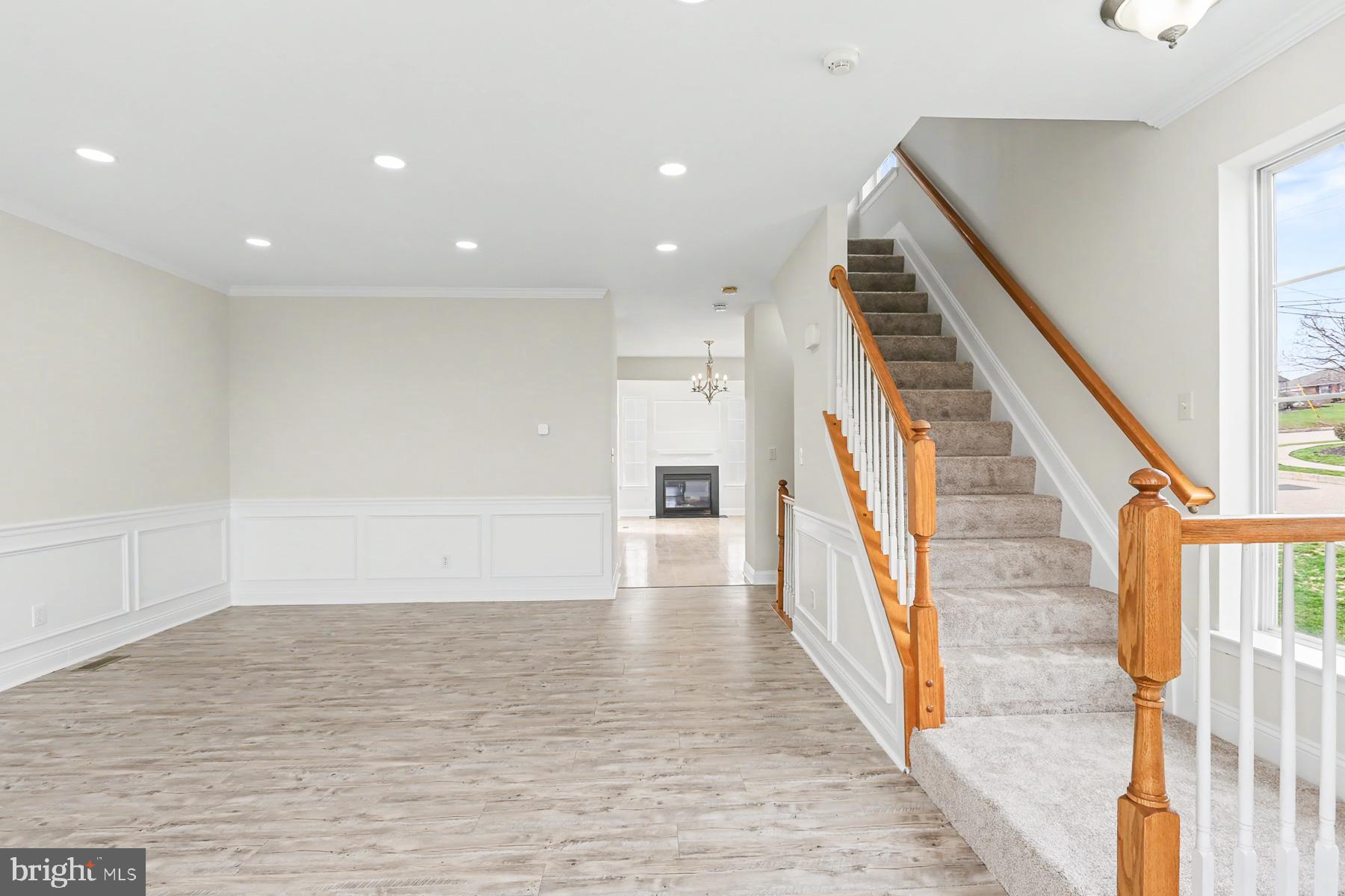 353 West Chestnut Street, Unit 16 Dallastown, PA 17313 - Photo 11 of 27 a view of a hallway with wooden floor and staircase