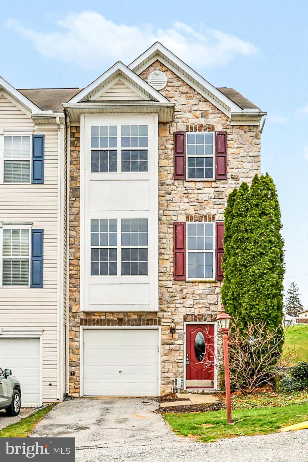353 West Chestnut Street, Unit 16 Dallastown, PA 17313 - Photo 2 of 27 a front view of a house with garden