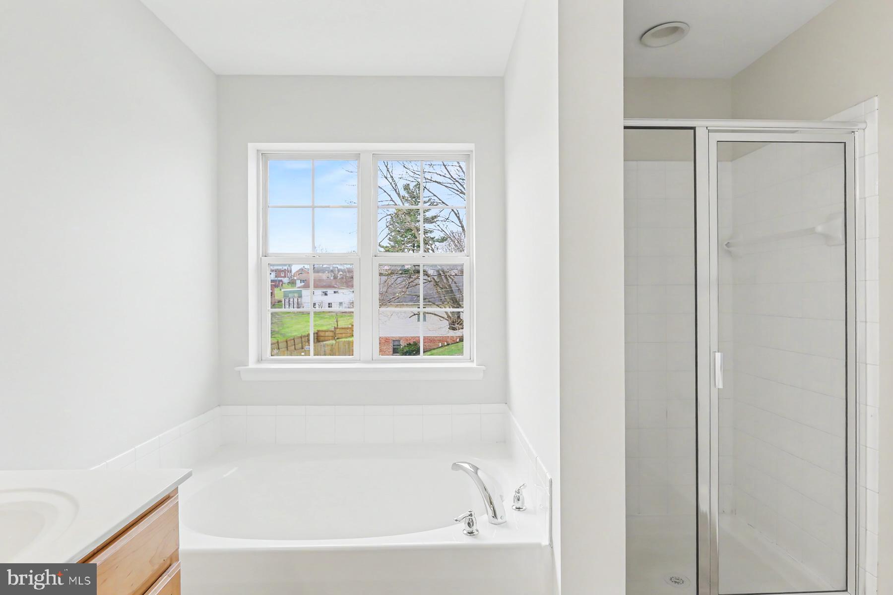 353 West Chestnut Street, Unit 16 Dallastown, PA 17313 - Photo 22 of 27 a white bath tub sitting next to a window
