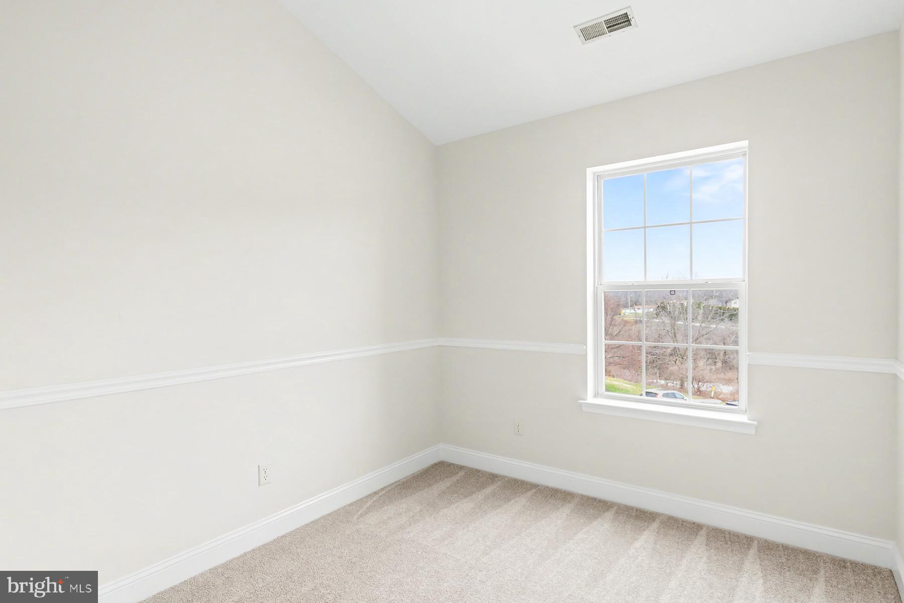 353 West Chestnut Street, Unit 16 Dallastown, PA 17313 - Photo 24 of 27 an empty room with a window