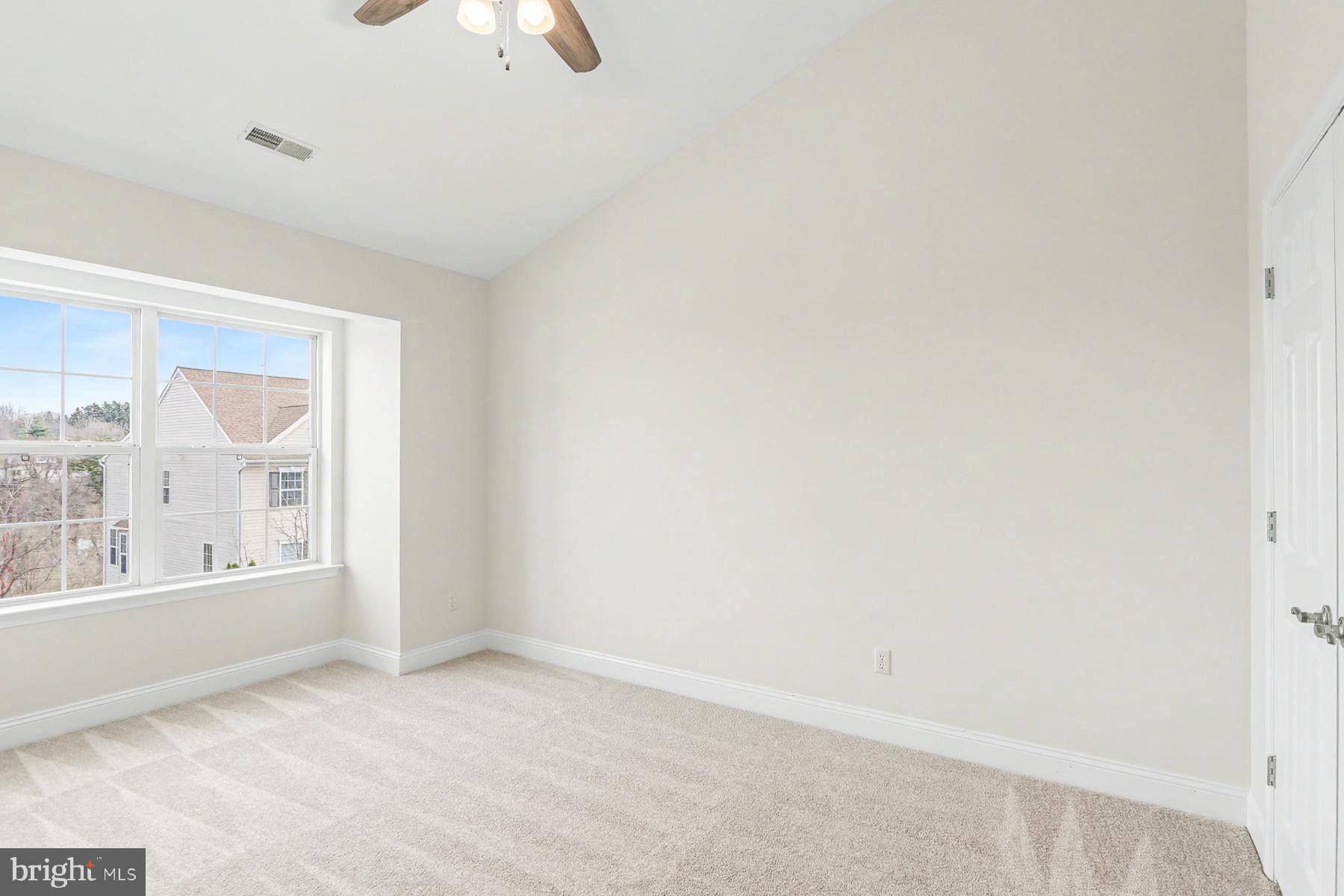 353 West Chestnut Street, Unit 16 Dallastown, PA 17313 - Photo 26 of 27 an empty room with windows and entrance