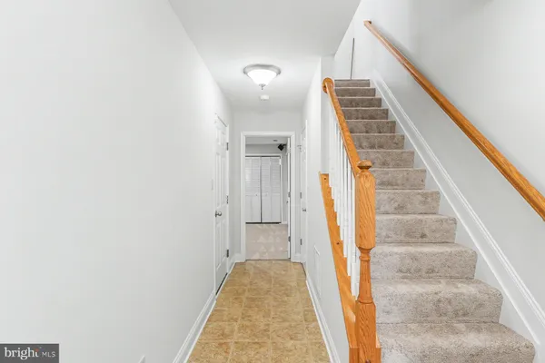 a view of staircase with white walls
