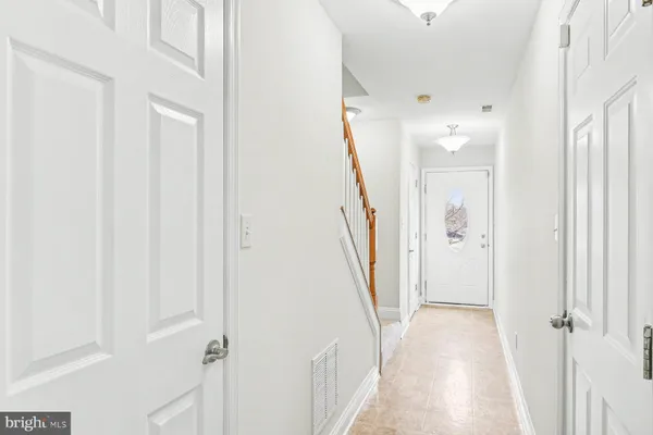 a view of a hallway with a white walls