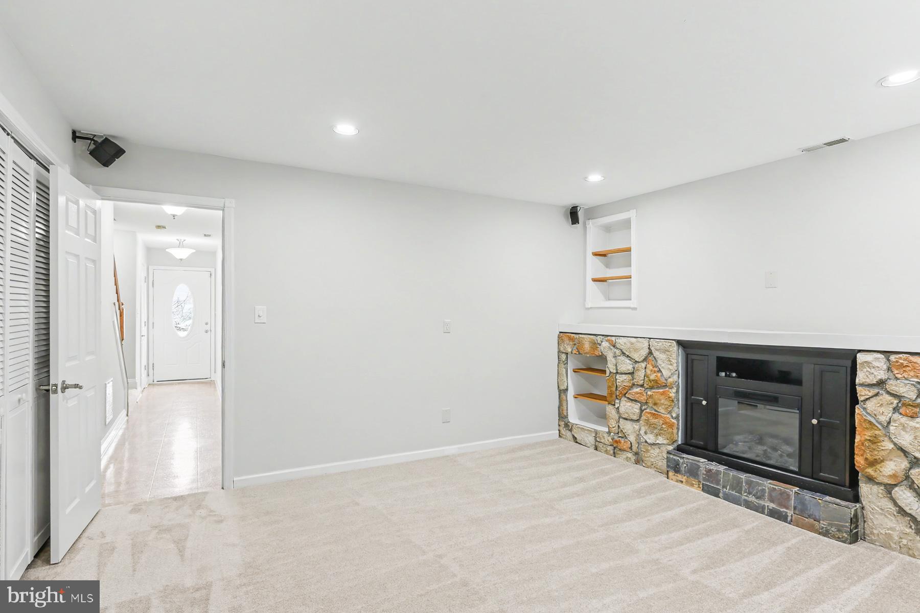 353 West Chestnut Street, Unit 16 Dallastown, PA 17313 - Photo 7 of 27 a view of empty room with a fireplace