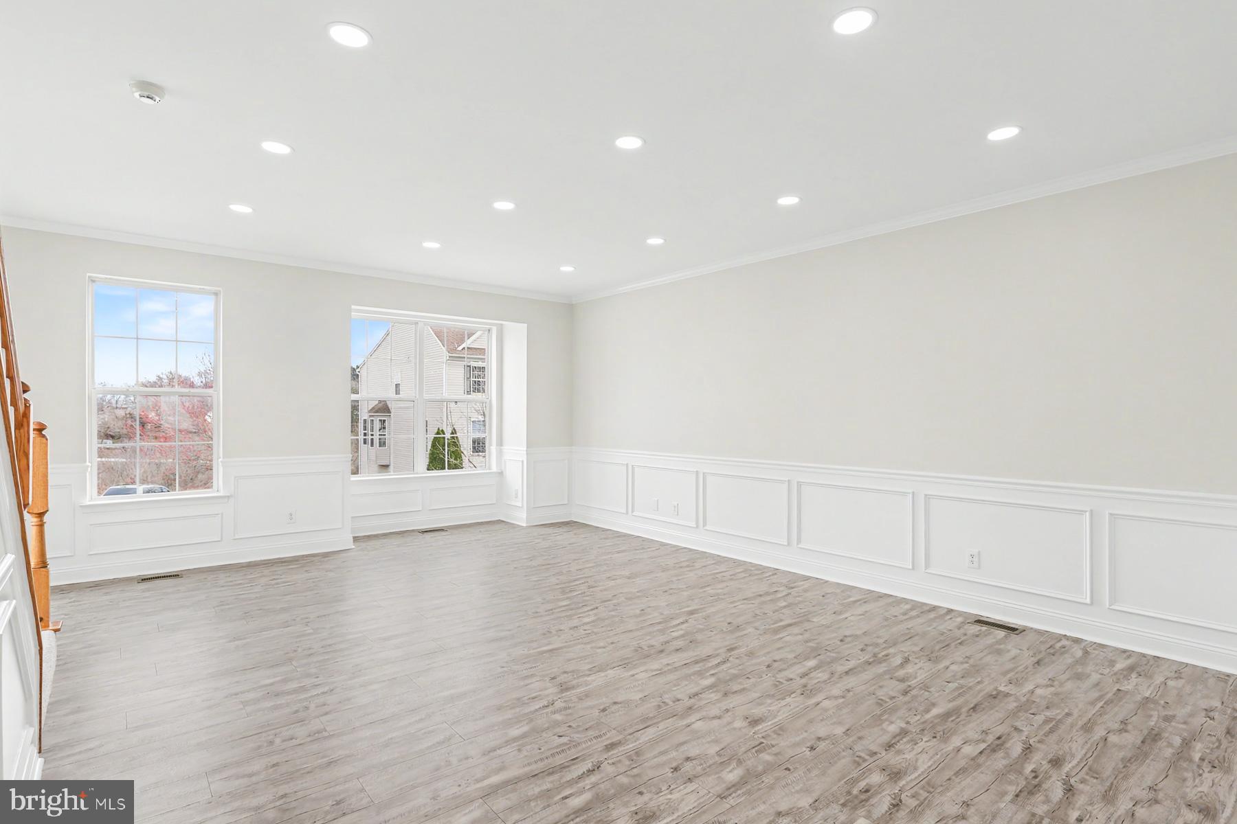 353 West Chestnut Street, Unit 16 Dallastown, PA 17313 - Photo 9 of 27 a view of an empty room with wooden floor and windows