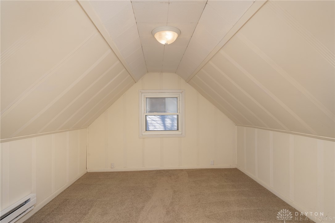 326 North Bromfield Road Kettering, OH 45429 - Photo 19 of 30 This cozy attic bedroom offers sloped ceilings and ample natural light through its window.