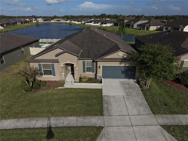 an aerial view of a house with a garden