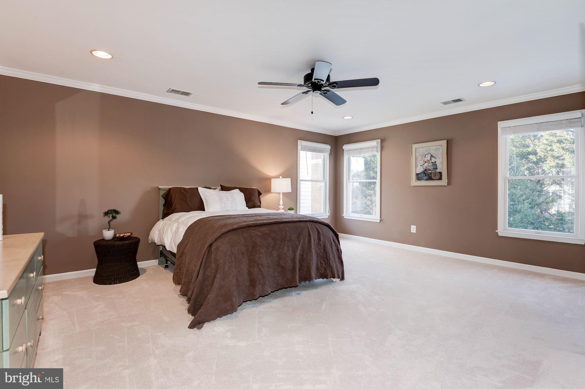 1326 Murray Downs Way Reston, VA 20194 - Photo 29 of 41 a spacious bedroom with a bed and window