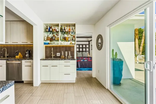 a bathroom with a black and white checkered floor