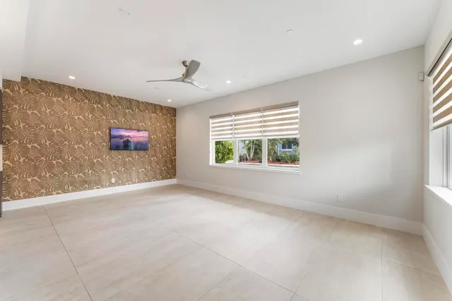 a kitchen with stainless steel appliances kitchen island a stove and a sink
