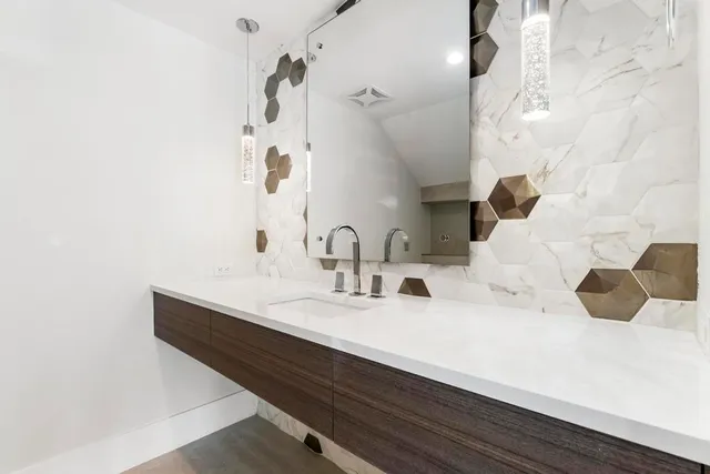 a bathroom with a sink and a bathtub