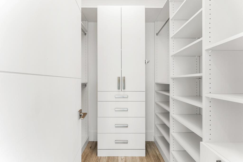 53 Southeast Seminole Street, Unit A Stuart, FL 34994 - Photo 34 of 75 a view of walk in closet with empty racks