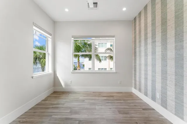 a view of a balcony with wooden floor