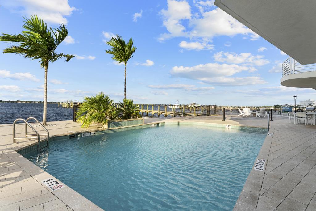 53 Southeast Seminole Street, Unit A Stuart, FL 34994 - Photo 6 of 75 a view of a lake with a yard