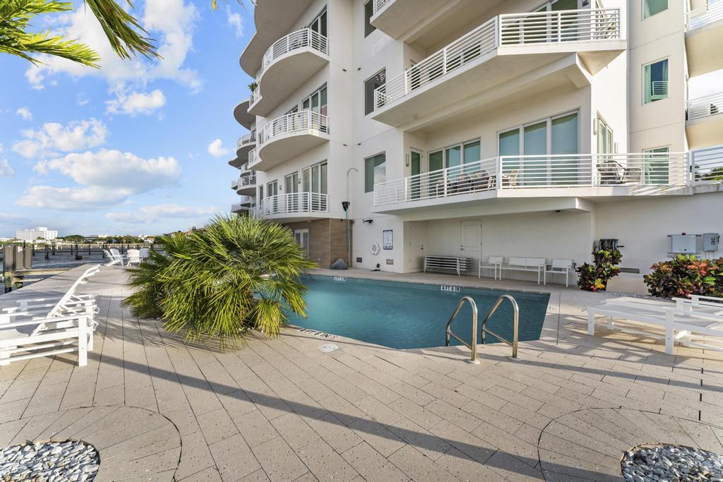 53 Southeast Seminole Street, Unit A Stuart, FL 34994 - Photo 64 of 75 a front view of a building with garden