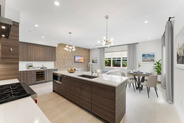 a kitchen with granite countertop a sink and stove