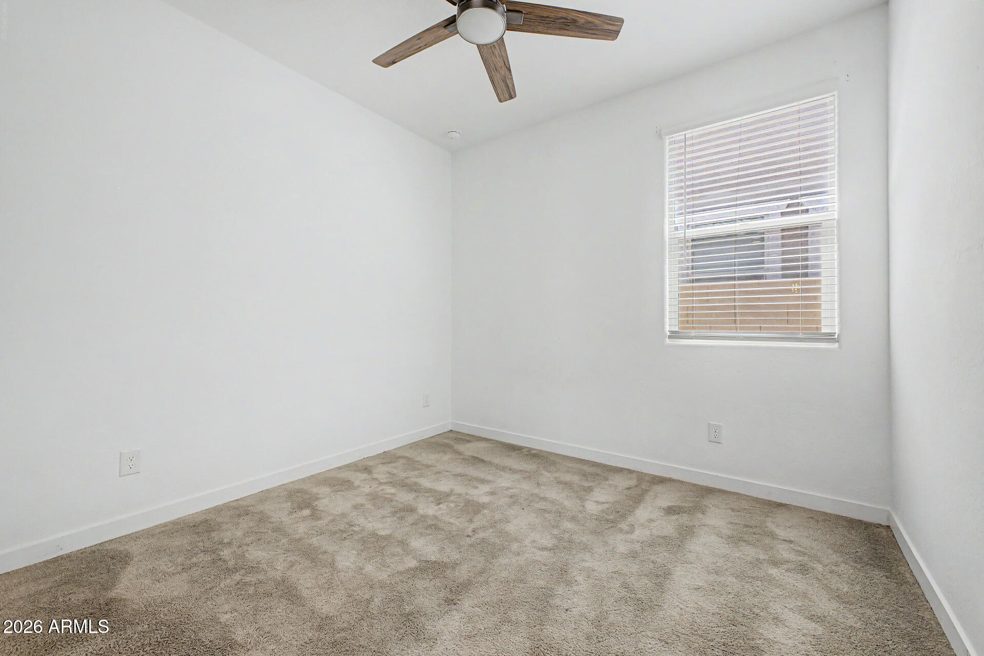 23080 East Stacey Road Queen Creek, AZ 85142 - Photo 30 of 42 an empty room with a window