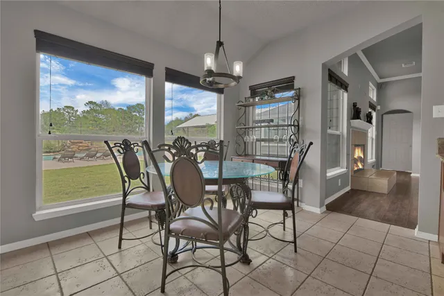 a spacious bedroom with a bed and a large window