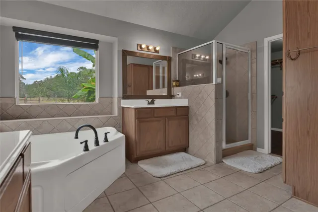 a bathroom with a sink a mirror and a bathtub