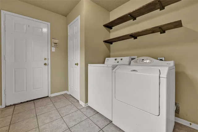 an outdoor space with patio and lake view