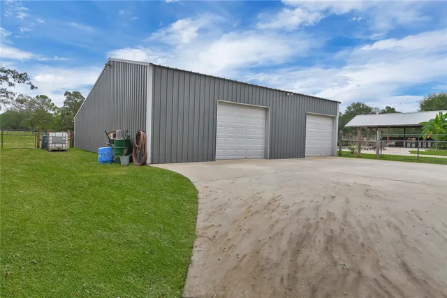 a view of a house with a yard and sitting area