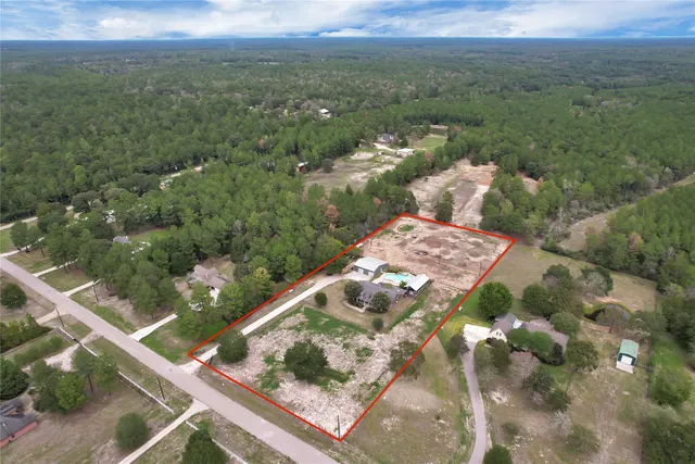 a view of a yard with an outdoor seating