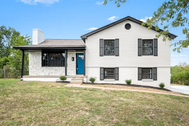 a view of house with yard