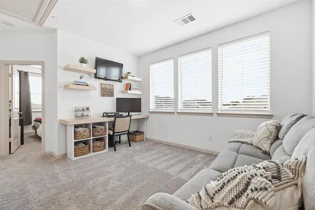 a bedroom with furniture and a window