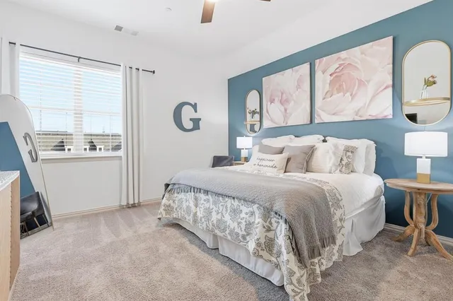 a bedroom with a bed and a window