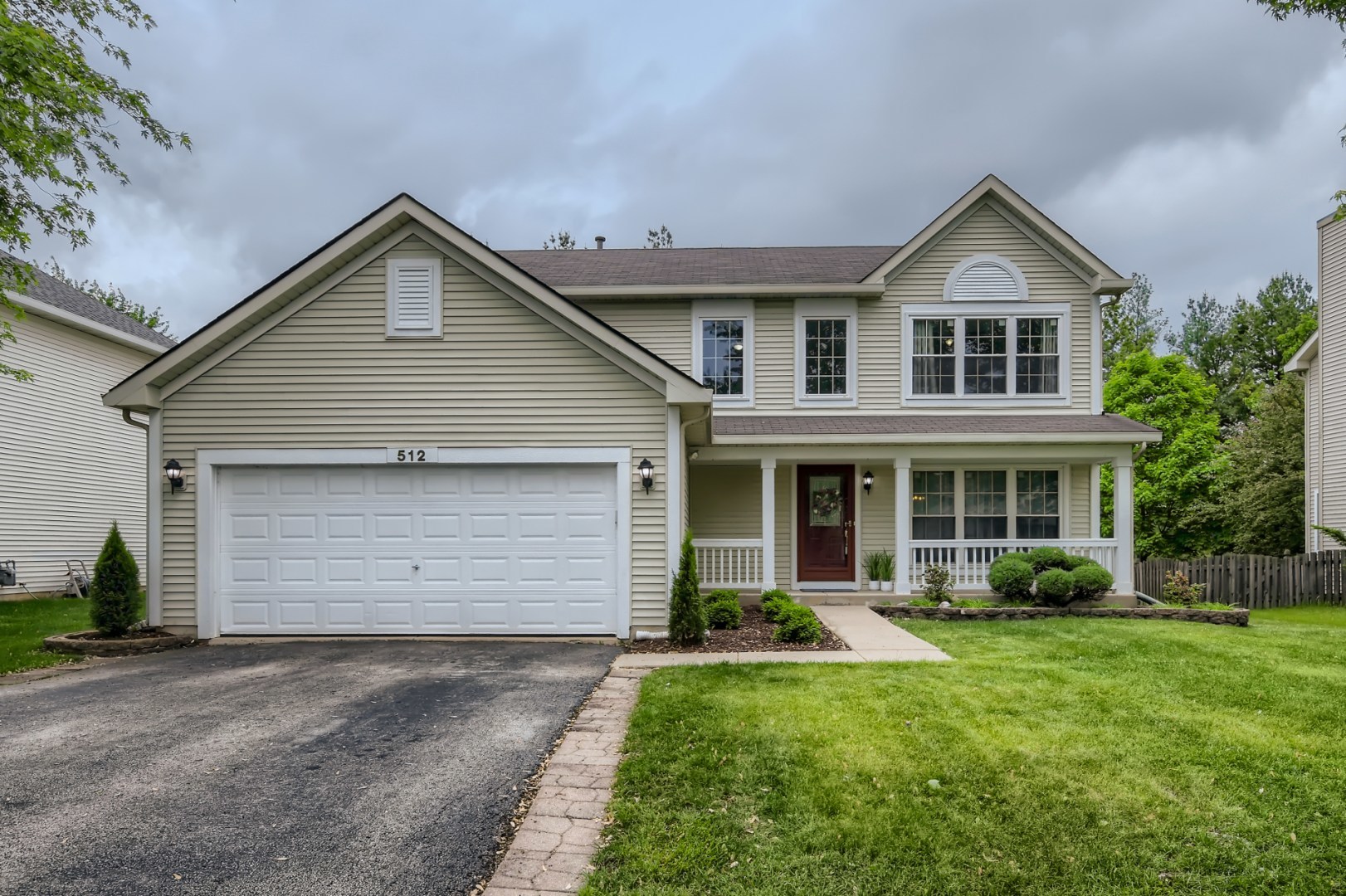 512 Susan Street Romeoville, IL 60446 - Photo 1 of 21 a front view of a house with a garden and yard