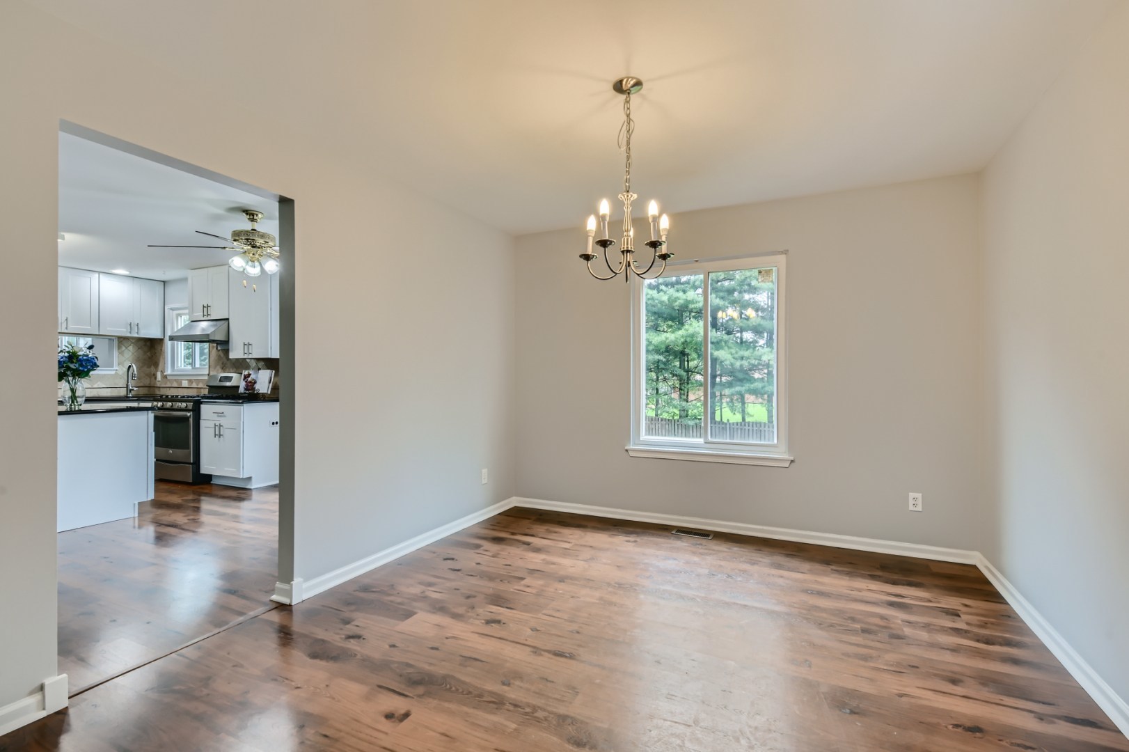 512 Susan Street Romeoville, IL 60446 - Photo 8 of 21 a view of a room with window and wooden floor