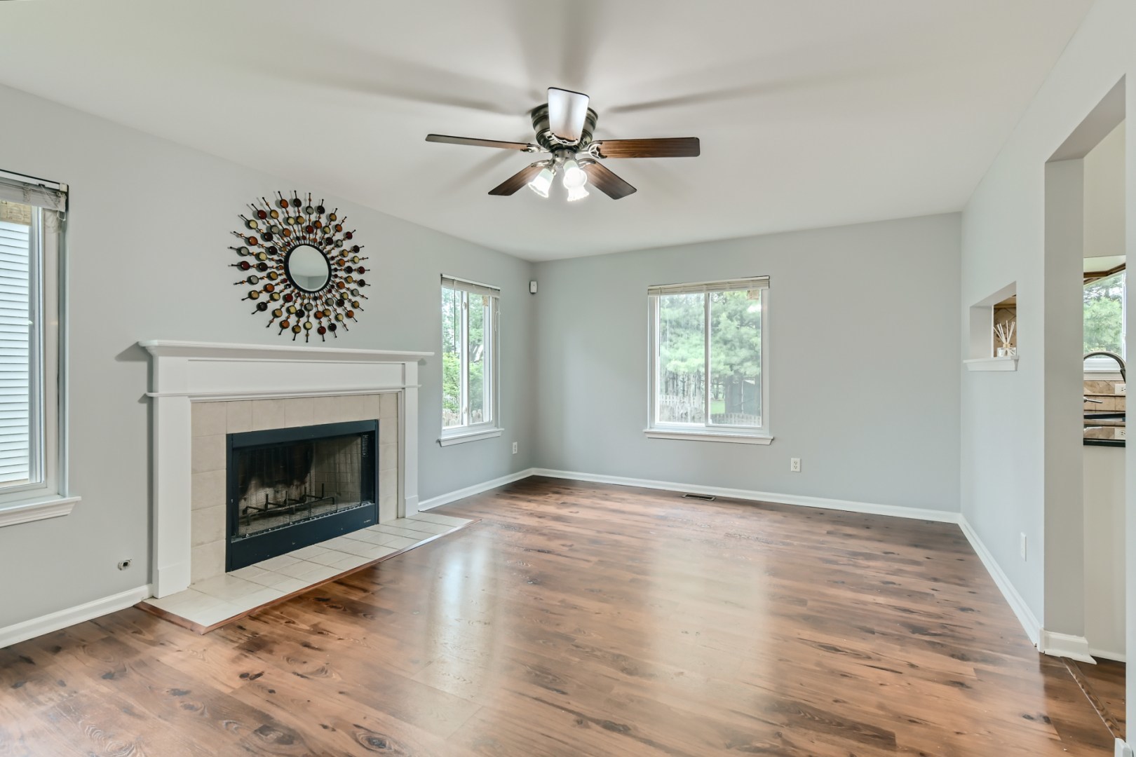512 Susan Street Romeoville, IL 60446 - Photo 9 of 21 a view of an empty room with wooden floor fireplace and a window
