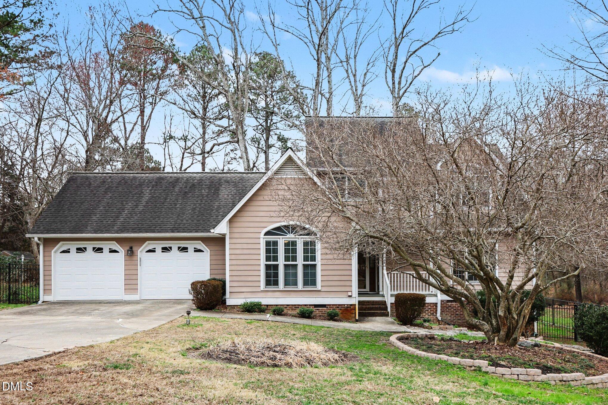 1121 Milton Road Durham, NC 27712 - Photo 1 of 31 a front view of a house with a yard and garage