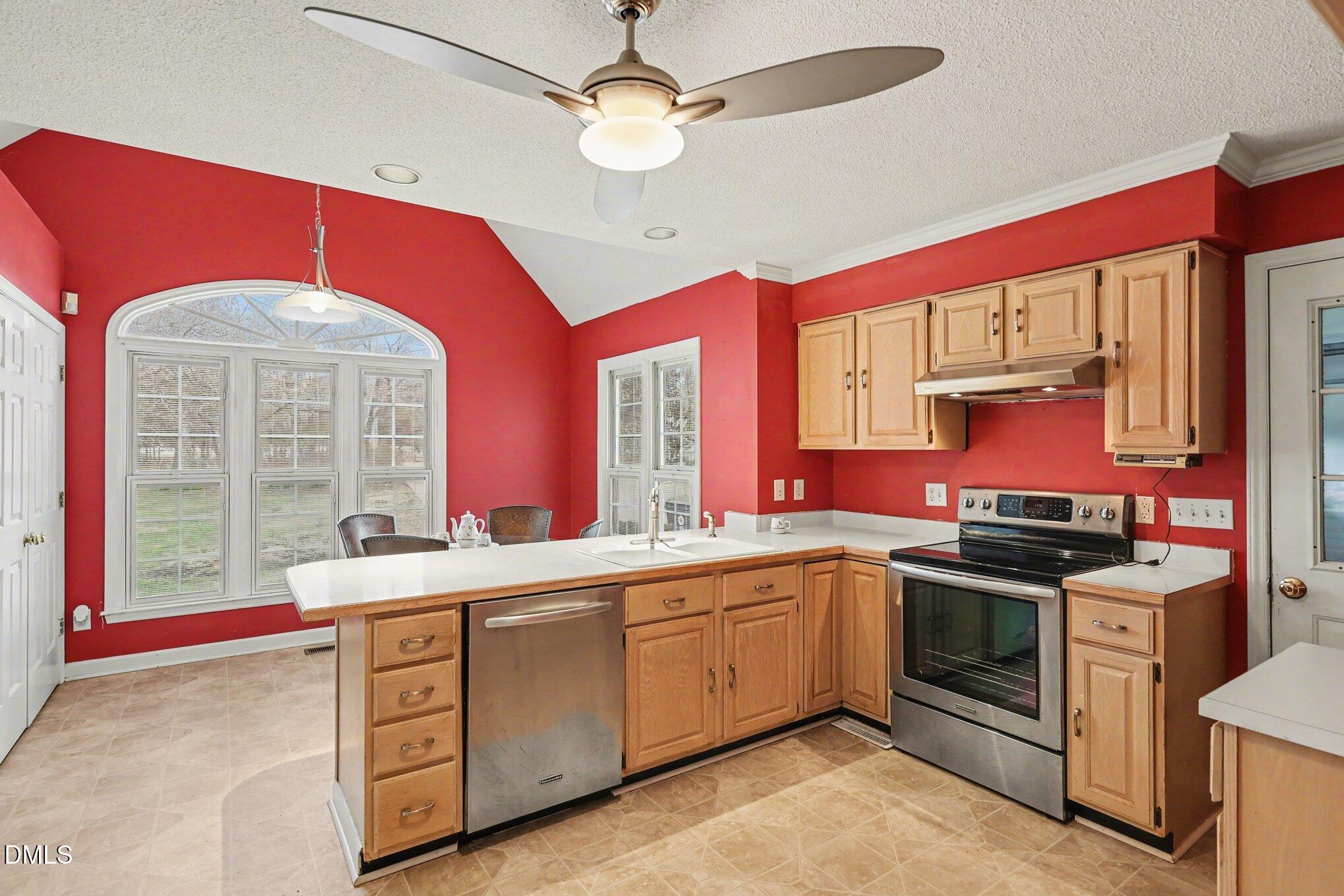 1121 Milton Road Durham, NC 27712 - Photo 11 of 31 a kitchen with a sink stove and cabinets