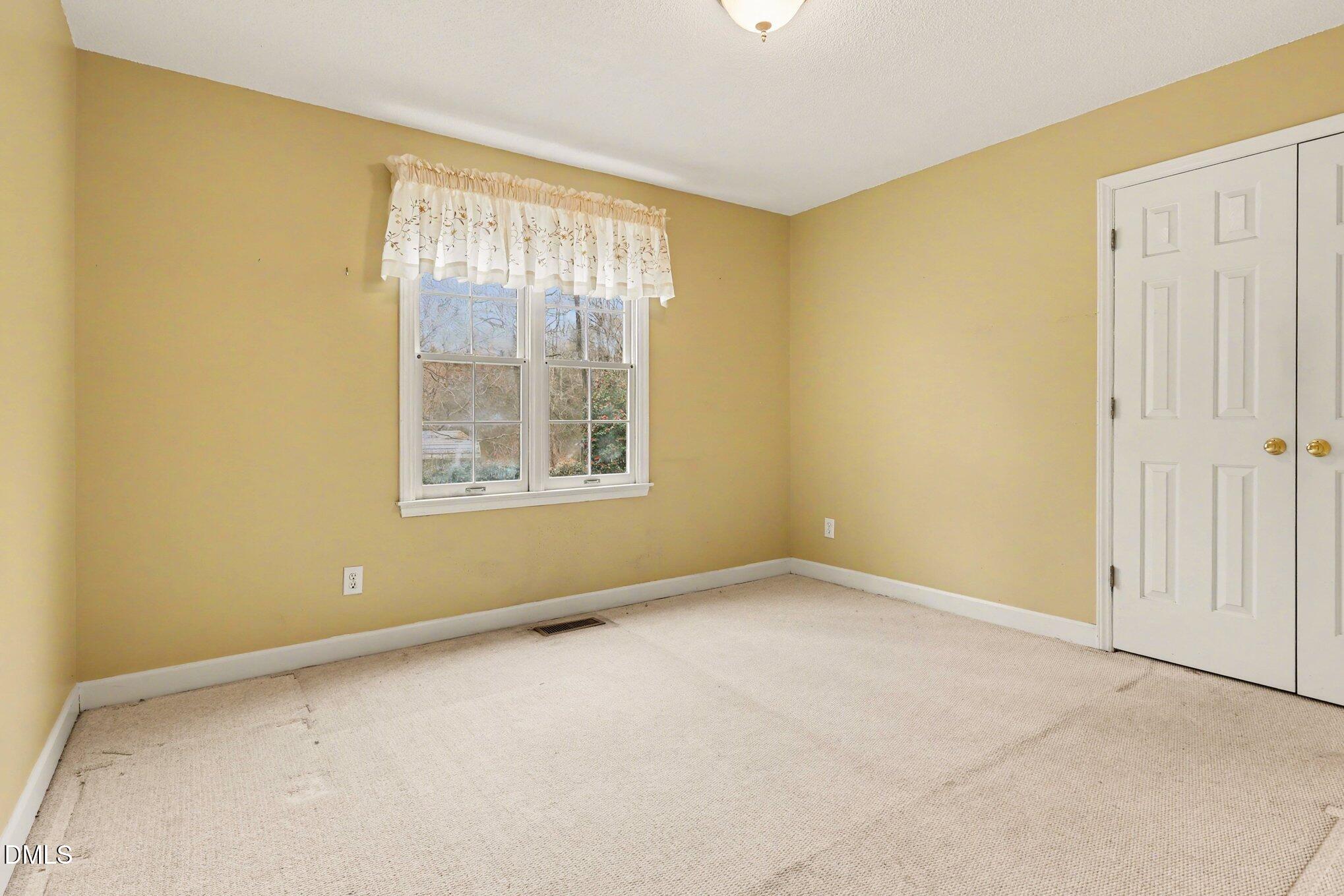 1121 Milton Road Durham, NC 27712 - Photo 16 of 31 an empty room with windows