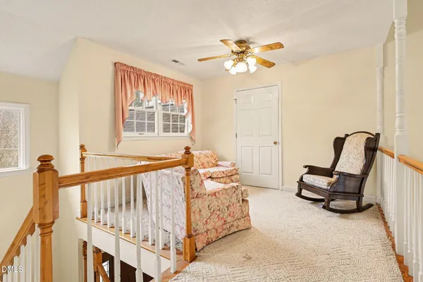 a bedroom with furniture and windows