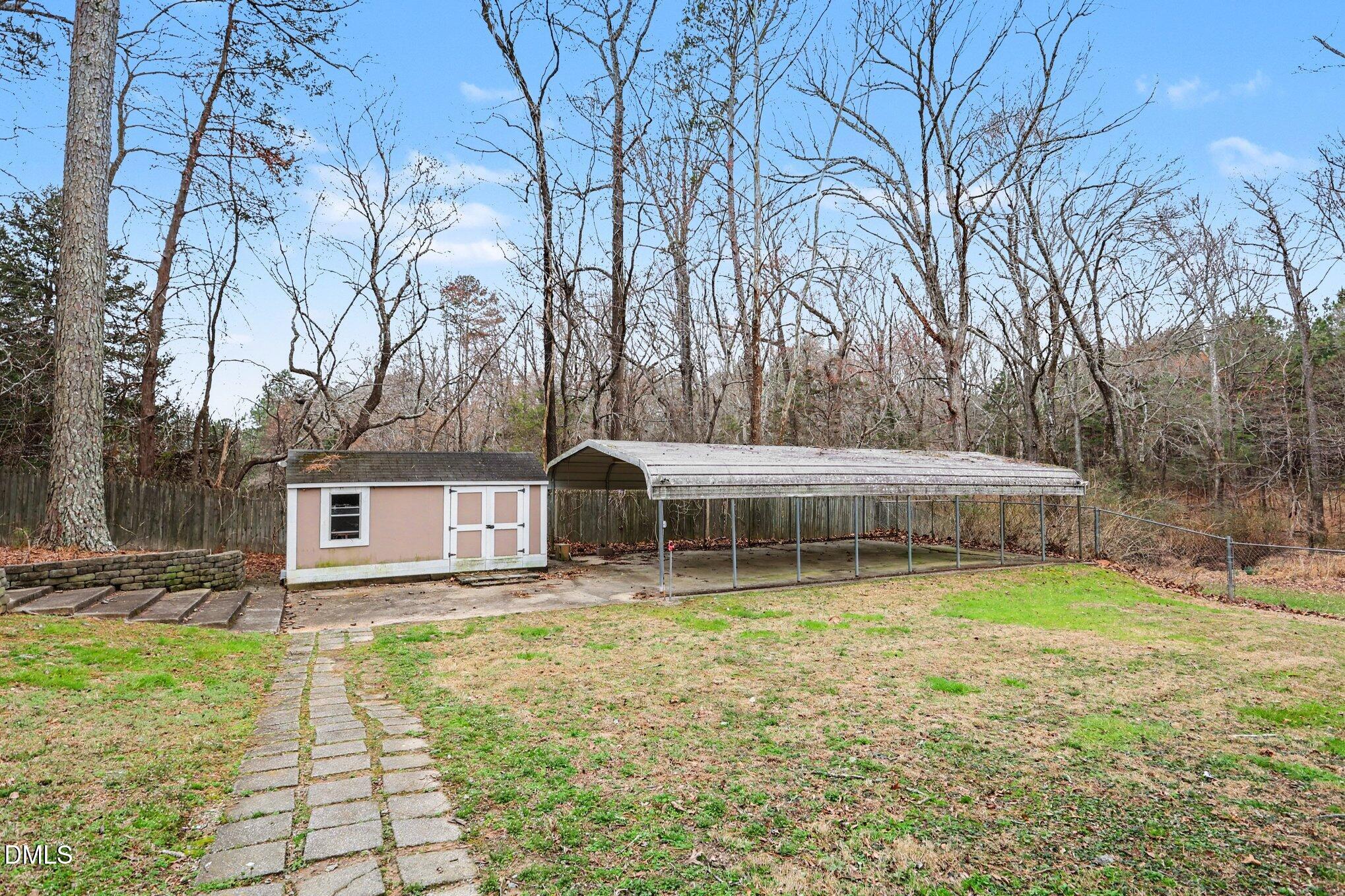 1121 Milton Road Durham, NC 27712 - Photo 31 of 31 a view of a house with backyard and sitting area