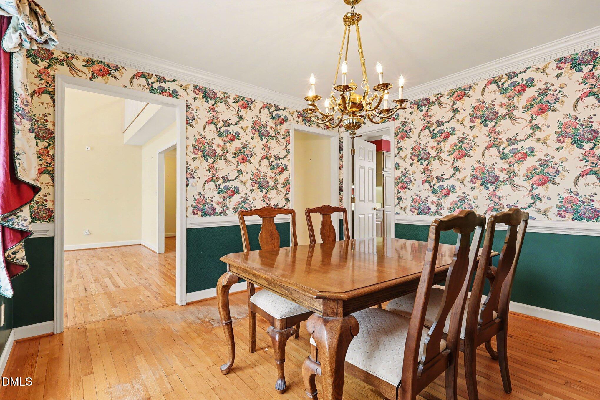 1121 Milton Road Durham, NC 27712 - Photo 8 of 31 a view of a dining room with furniture and chandelier
