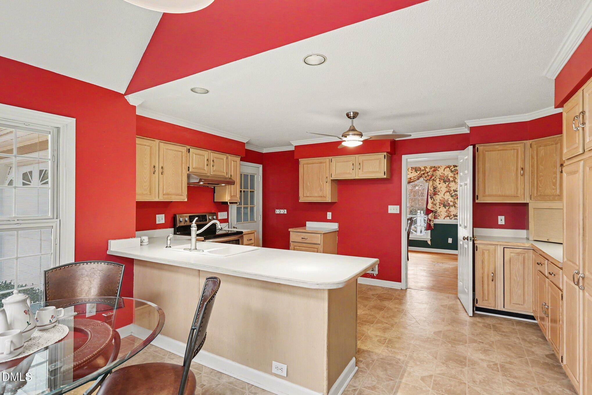 1121 Milton Road Durham, NC 27712 - Photo 10 of 31 a view of a dining room with furniture and a chandelier
